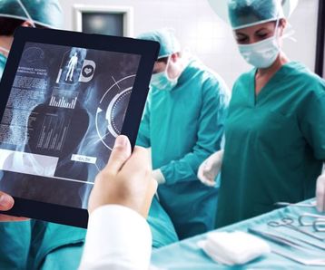 Man using tablet pc against medical interface on xray
